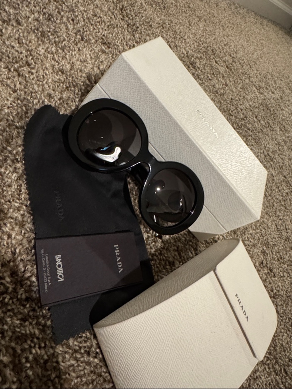 Authentic Prada round swirl sunglasses black